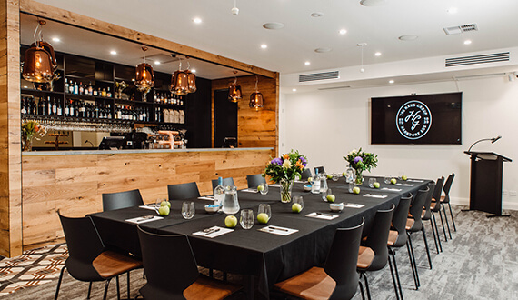 A conference set up in a modern venue with rustic wooden furnishings