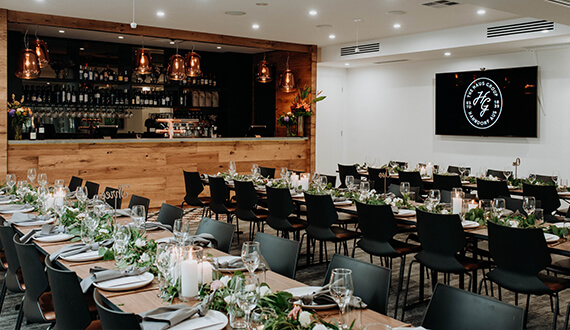 A conference set up in a modern venue with rustic wooden furnishings