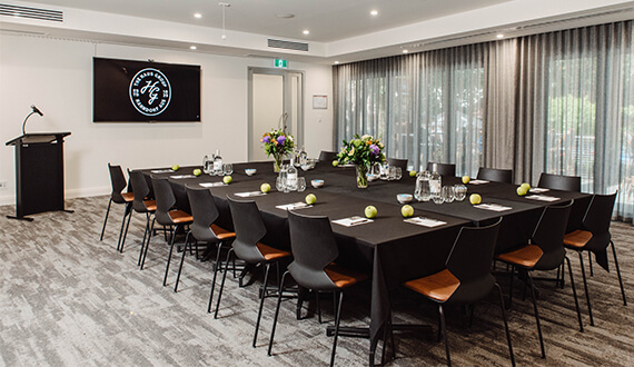 A conference set up in a modern venue with rustic wooden furnishings